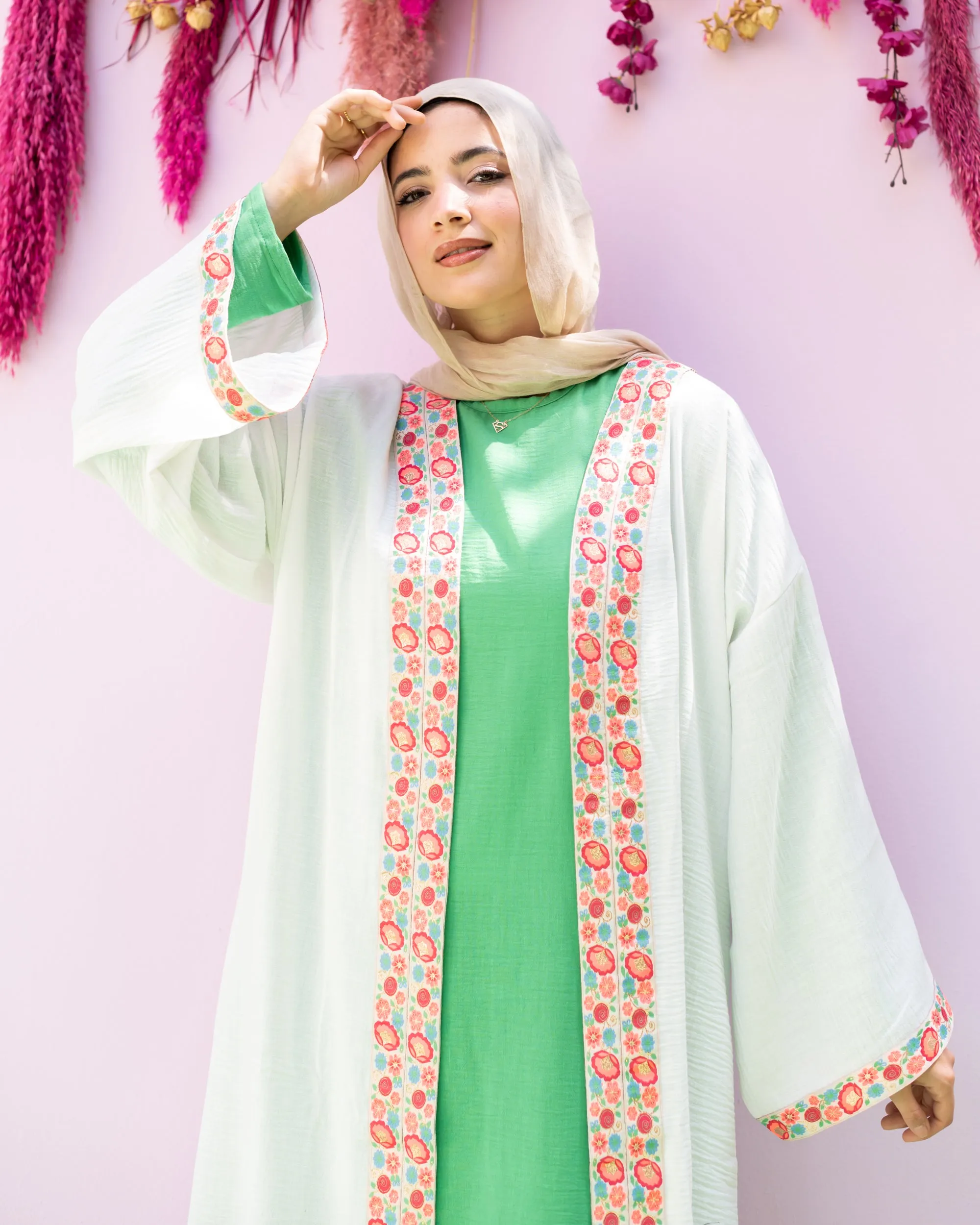 white cloak with flower tape